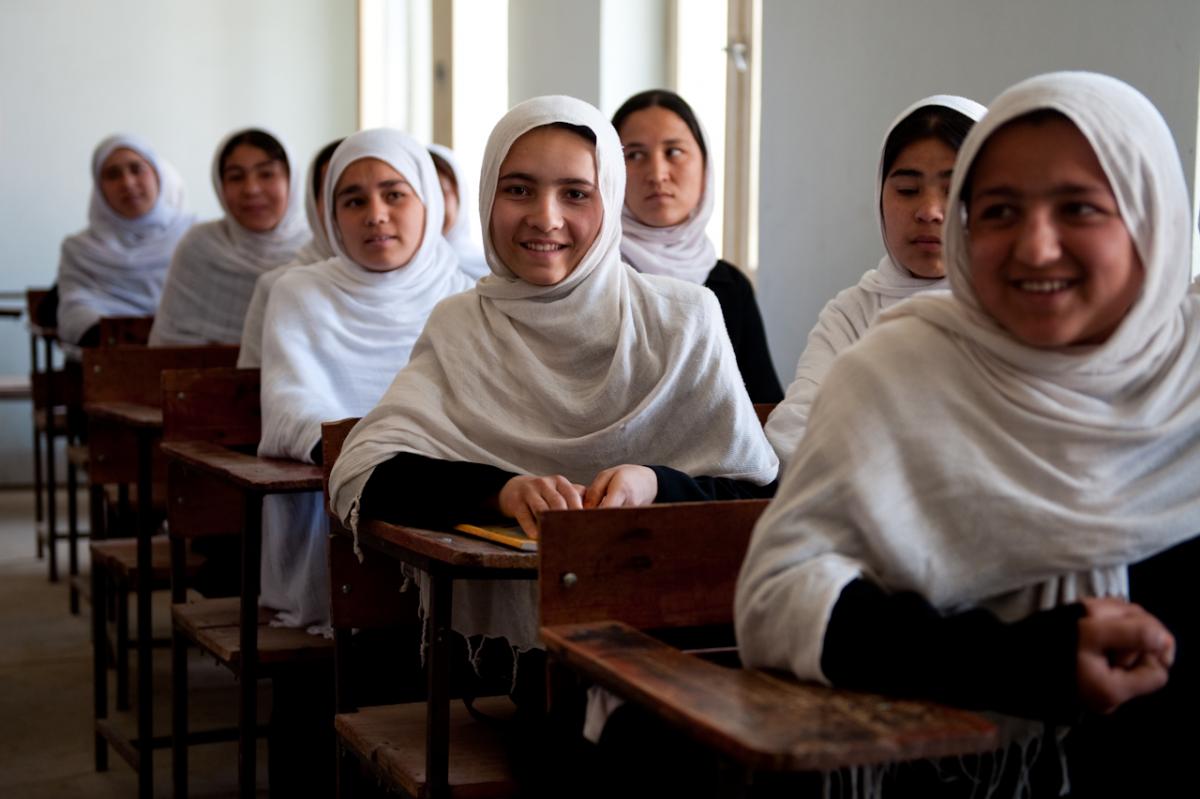 In Afghanistan, literacy and primary school completion rates for young women are far below that of their male counterparts. This photo submitted by Muhammad Akbar Qati, regional manager for Northern Afghanistan inspires hope that the gap could be shrinking. During a class and with smiles on their faces, these Afghan girls freely discuss the concept of democracy. Democracy means education for all.