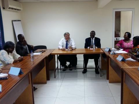 NDI President Kenneth Wollack and Dr. Chris Fomunyoh (center) meet with Senior Resident Director Aminata Kasse and her team in Ouagadougou.